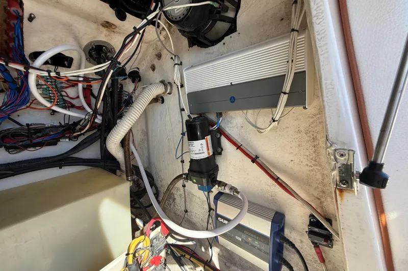 Slide: The Image of Electrical and mechanical components inside a 2005 Renegade 29CC boat. - 25