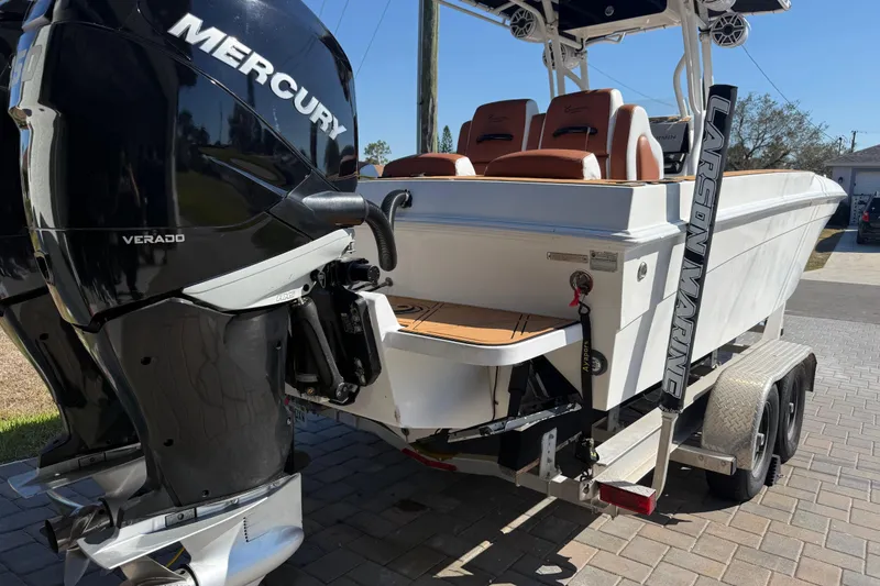 Slide: The Image of 2005 Renegade 29CC boat with Mercury Verado engine on a trailer. - 41