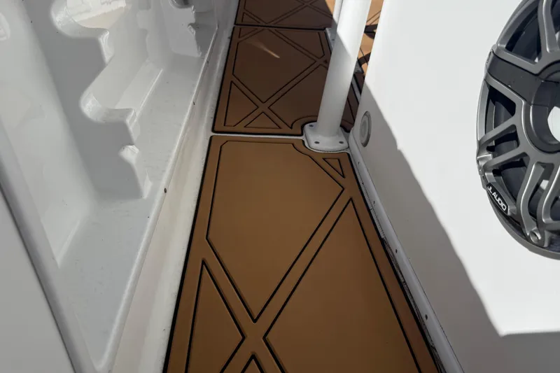 Slide: The Image of 2005 Renegade 29CC boat deck with custom flooring and JL Audio speaker. - 57