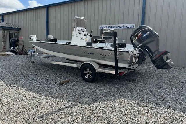 Slide: The Image of 2026 Xpress H20B Bay boat on trailer, parked outside Andalusia Marine. - 10
