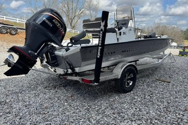 Slide: The Image of 2026 Xpress H20B Bay boat on trailer with Yamaha engine, parked on gravel. - 8