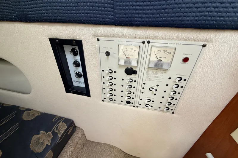 Slide: The Image of Control panel of a 2004 Larson 274 boat with gauges and switches. - 10