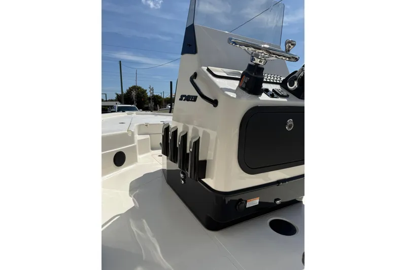 Slide: The Image of 2026 Skeeter SX221 boat console with steering wheel and storage compartments. - 10