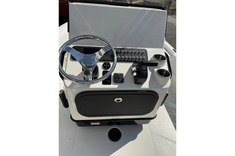 Slide: The Image of 2026 Skeeter SX221 boat console with steering wheel and controls. - 12