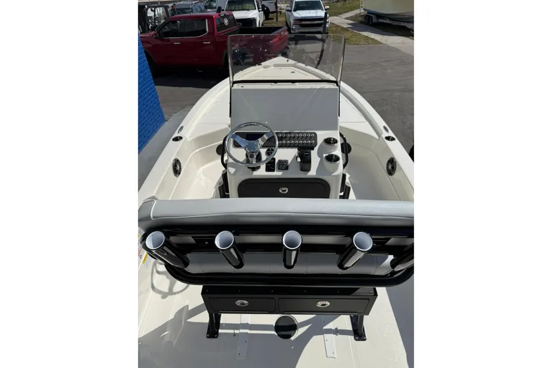 Slide: The Image of 2026 Skeeter SX221 boat interior with steering console and rod holders. - 5