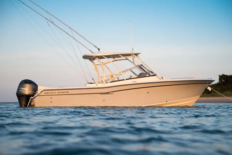 Slide: The Image of Manufacturer Provided Image: 2017 Grady-White Freedom 275 boat on calm water at sunset. - 6