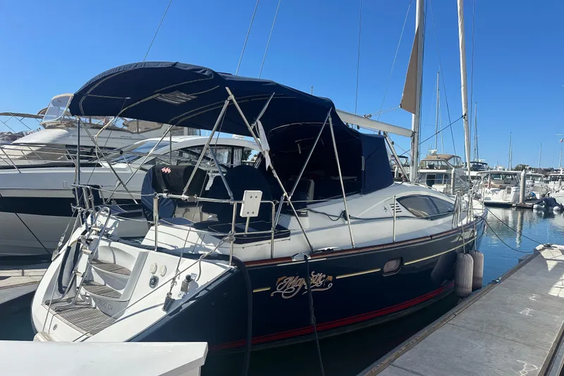 The Image of 2008 Jeanneau Sun Odyssey 45 DS sailboat docked in marina under clear blue sky. - 1