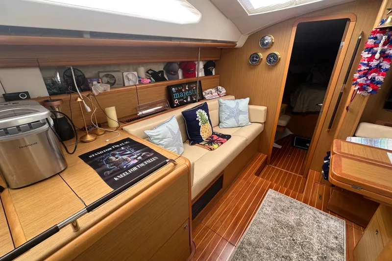 Slide: The Image of Interior of 2008 Jeanneau Sun Odyssey 45 DS sailboat with cozy seating and nautical decor. - 10