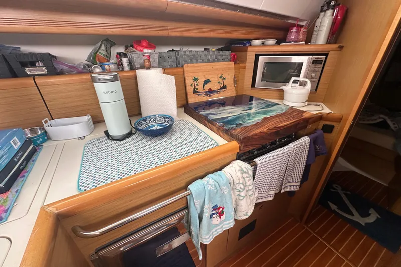 Slide: The Image of Cozy kitchen area in a 2008 Jeanneau Sun Odyssey 45 DS sailboat. - 14