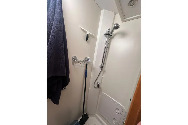 Slide: The Image of Shower area in 2008 Jeanneau Sun Odyssey 45 DS sailboat, featuring modern fixtures and storage. - 16