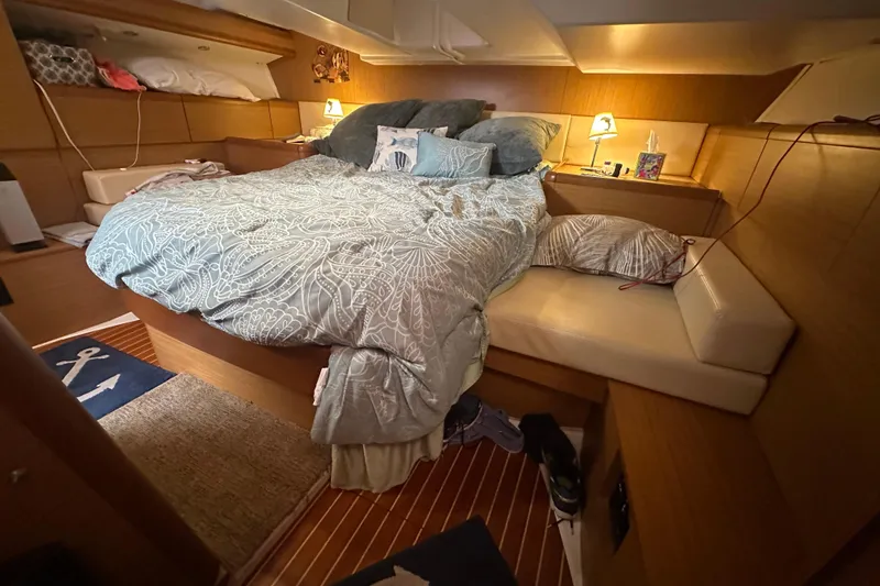 Slide: The Image of Cozy cabin interior of 2008 Jeanneau Sun Odyssey 45 DS with comfortable bedding and warm lighting. - 17