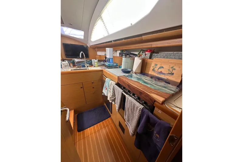 Slide: The Image of Interior of 2008 Jeanneau Sun Odyssey 45 DS yacht kitchen with wooden cabinetry. - 19