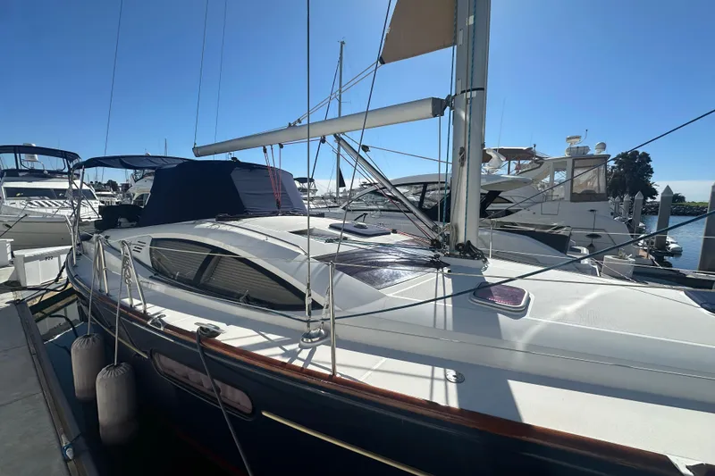 Slide: The Image of 2008 Jeanneau Sun Odyssey 45 DS sailboat docked at marina under clear blue sky. - 2