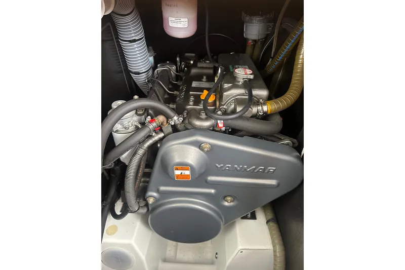 Slide: The Image of Engine compartment of a 2008 Jeanneau Sun Odyssey 45 DS sailboat, featuring a Yanmar engine. - 23