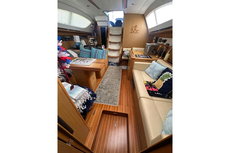 Slide: The Image of Interior of 2008 Jeanneau Sun Odyssey 45 DS sailboat with cozy seating and wooden finishes. - 24