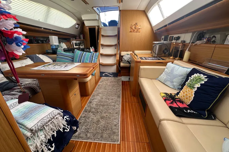 Slide: The Image of Interior of 2008 Jeanneau Sun Odyssey 45 DS yacht, featuring cozy seating and nautical decor. - 25