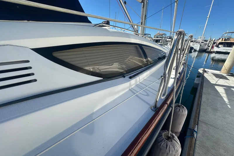 Slide: The Image of 2008 Jeanneau Sun Odyssey 45 DS sailboat docked at marina, side view. - 3