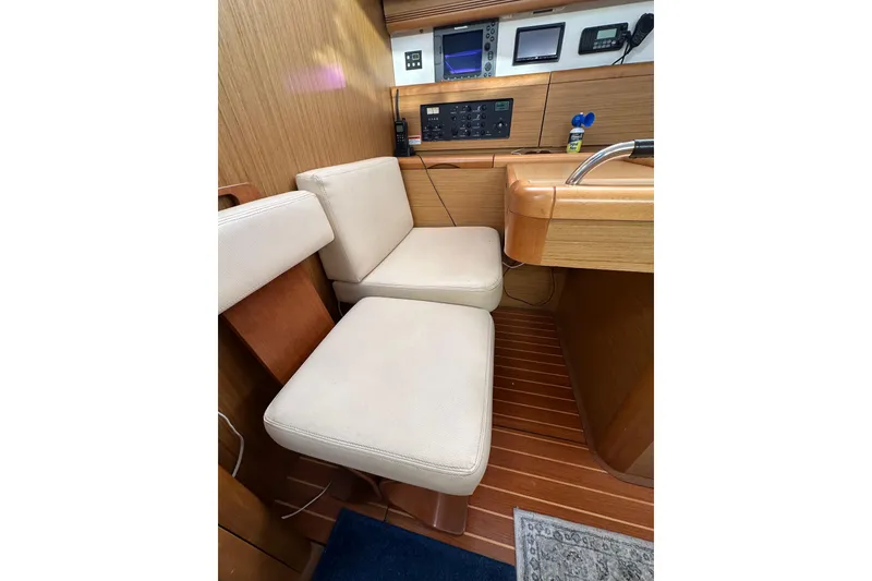 Slide: The Image of Interior of 2008 Jeanneau Sun Odyssey 45 DS yacht with beige seating and navigation equipment. - 41
