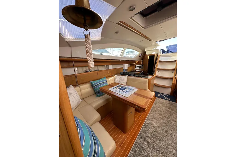 Slide: The Image of Luxurious interior of 2008 Jeanneau Sun Odyssey 45 DS sailboat with elegant seating and wooden finishes. - 43