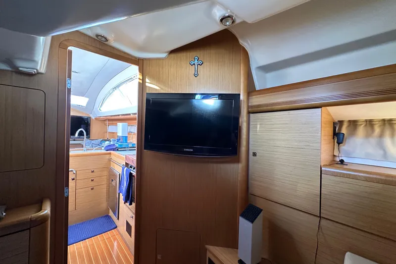 Slide: The Image of Interior of 2008 Jeanneau Sun Odyssey 45 DS yacht with TV and kitchen area. - 45