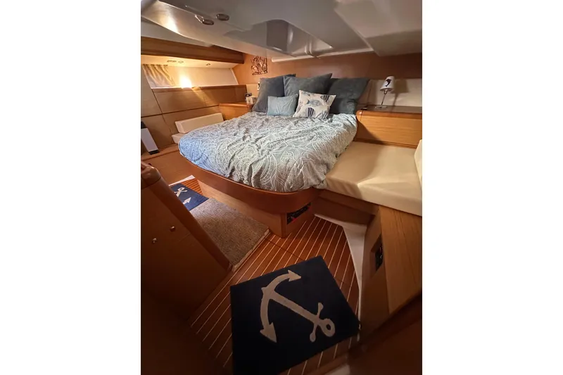 Slide: The Image of Luxurious cabin interior of 2008 Jeanneau Sun Odyssey 45 DS sailboat with cozy bedding. - 48