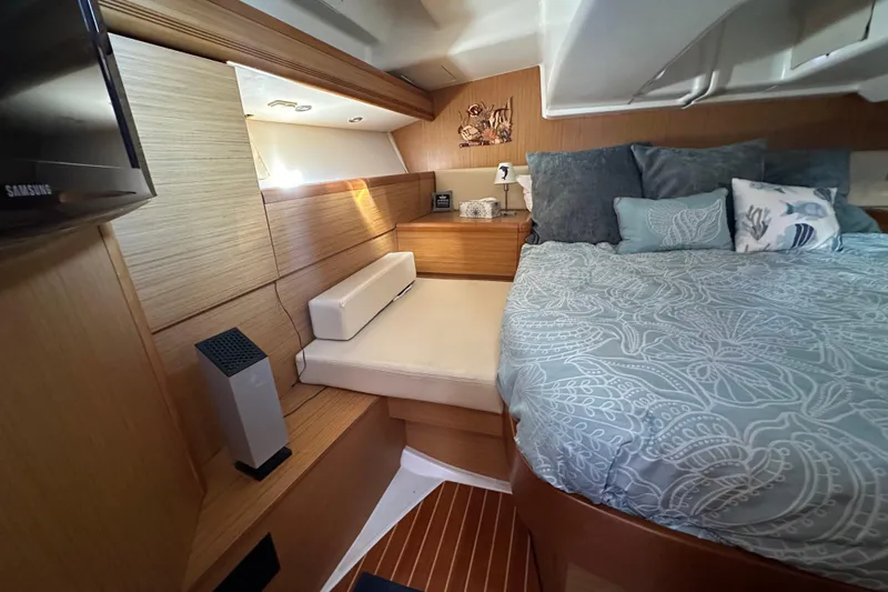 Slide: The Image of Interior of 2008 Jeanneau Sun Odyssey 45 DS yacht, featuring cozy bedroom with elegant bedding. - 49