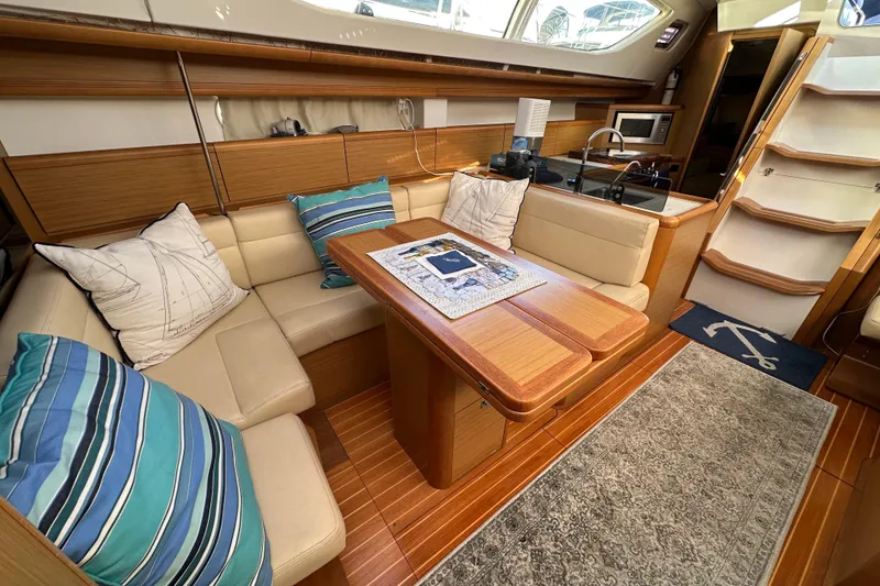 Slide: The Image of Luxurious interior of 2008 Jeanneau Sun Odyssey 45 DS yacht with cozy seating and elegant decor. - 51