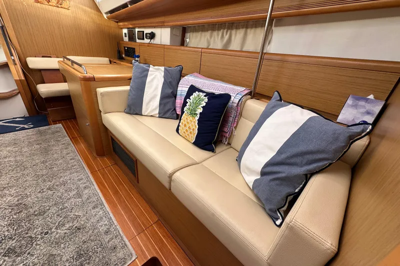 Slide: The Image of Interior of 2008 Jeanneau Sun Odyssey 45 DS with cozy seating and decorative pillows. - 52