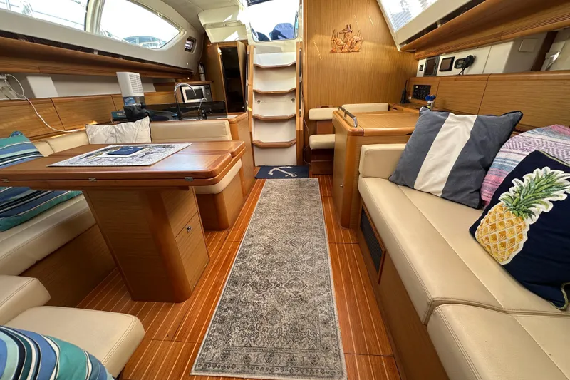 Slide: The Image of Interior of 2008 Jeanneau Sun Odyssey 45 DS yacht with cozy seating and elegant wood finish. - 53