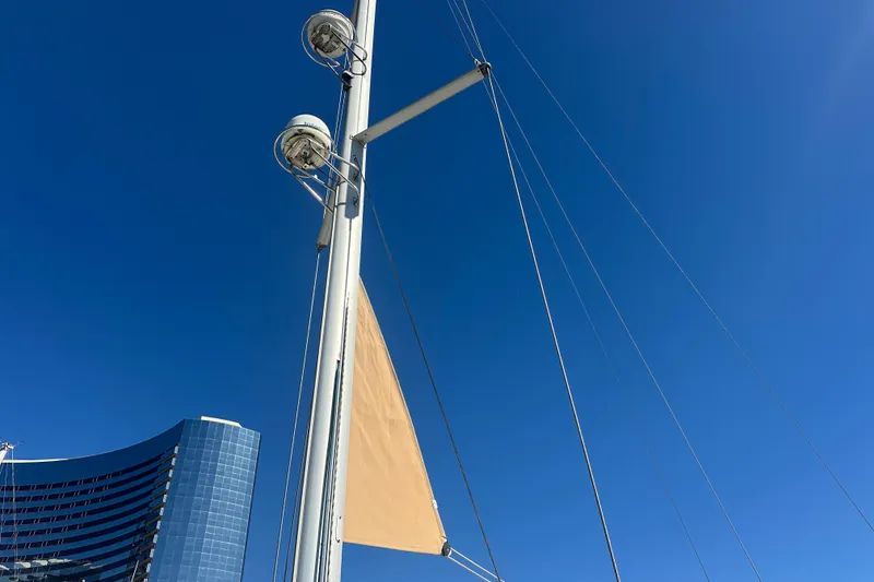 Slide: The Image of Mast of 2008 Jeanneau Sun Odyssey 45 DS sailboat against clear blue sky. - 7