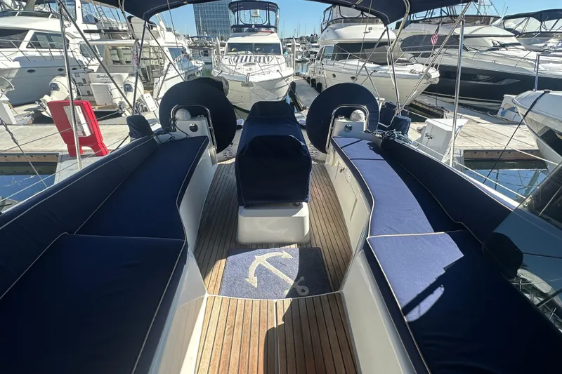 Slide: The Image of 2008 Jeanneau Sun Odyssey 45 DS sailboat with blue seating, docked at a marina. - 8