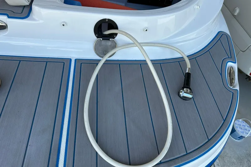 Slide: The Image of 2013 Rinker 276 Captiva Bowrider swim platform with shower hose. - 18