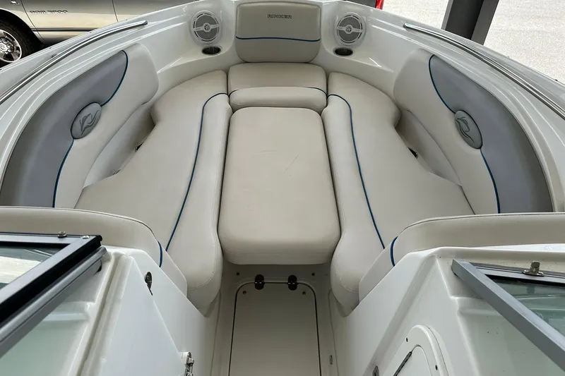 Slide: The Image of 2013 Rinker 276 Captiva Bowrider interior with white cushioned seating. - 23