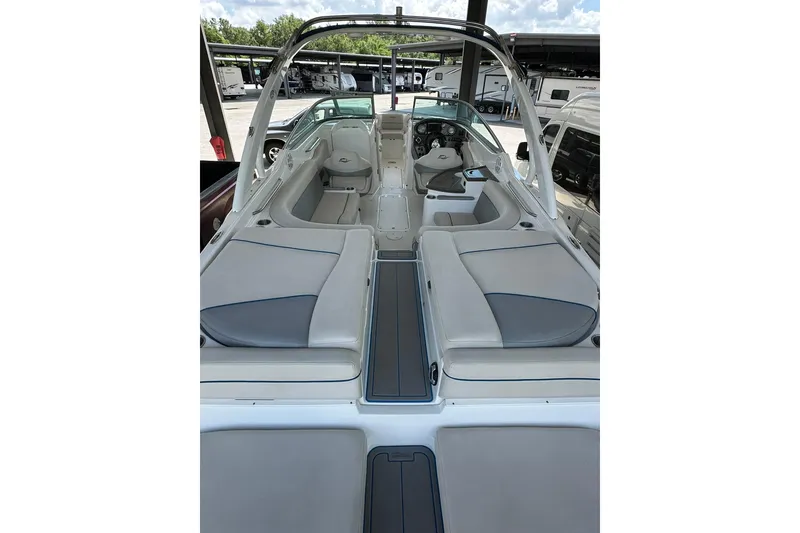 Slide: The Image of 2013 Rinker 276 Captiva Bowrider interior with spacious seating and sleek design. - 4