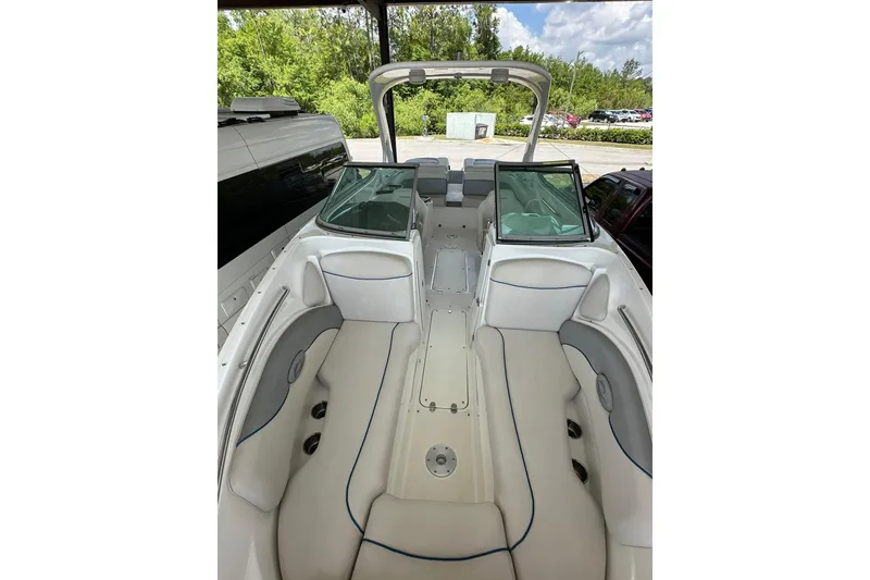 Slide: The Image of 2013 Rinker 276 Captiva Bowrider interior with spacious seating and sleek design. - 5