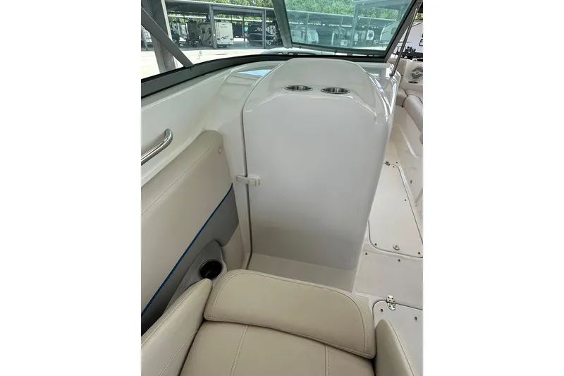 Slide: The Image of 2013 Rinker 276 Captiva Bowrider interior with seating and cup holders. - 9