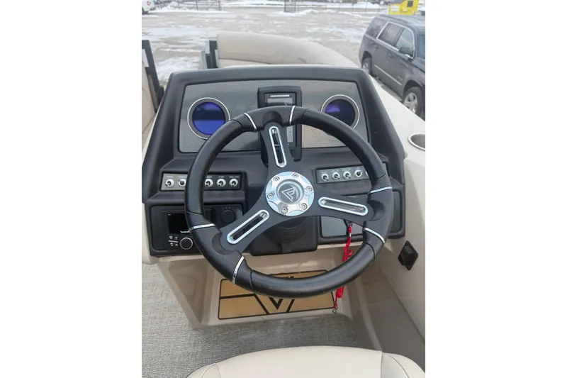 Slide: The Image of 2022 Viaggio Diamante 23U boat dashboard with steering wheel and control panel. - 11
