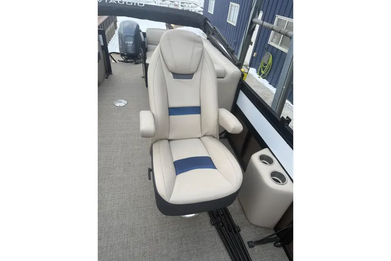 Slide: The Image of 2022 Viaggio Diamante 23U boat seat with beige and blue accents, cup holders visible. - 13