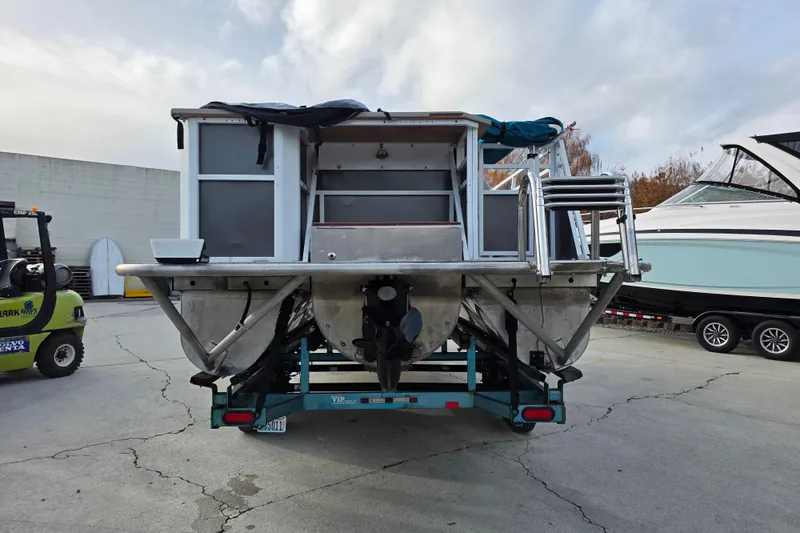 Slide: The Image of 2001 J C Manufacturing TRITOON 226 I/O boat on trailer, rear view. - 1