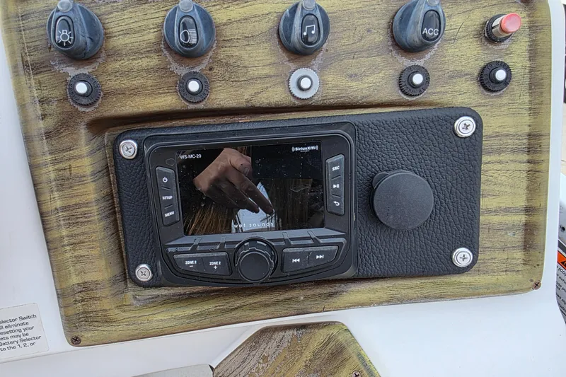 Slide: The Image of Boat dashboard with control panel and stereo system, J C Manufacturing TRITOON 226 I/O, 2001 model. - 10