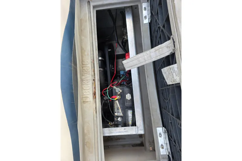 Slide: The Image of Battery compartment of 2001 J C Manufacturing TRITOON 226 I/O boat, featuring wiring and components. - 13