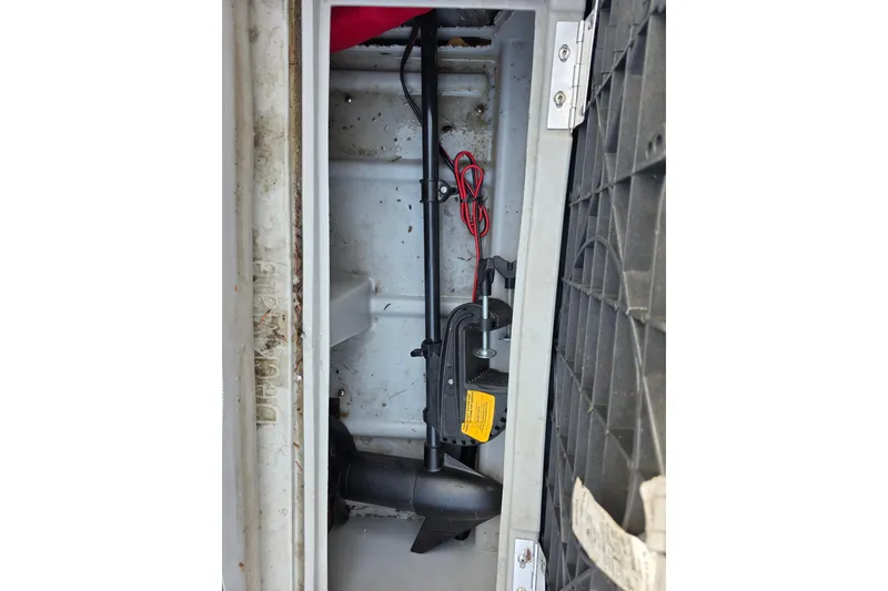 Slide: The Image of 2001 J C Manufacturing TRITOON 226 I/O interior compartment with wiring and components. - 12