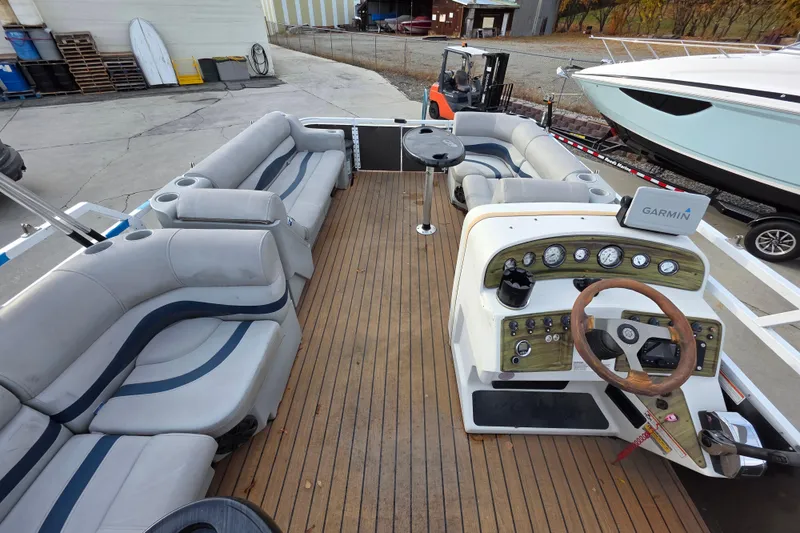 Slide: The Image of 2001 J C Manufacturing TRITOON 226 I/O with spacious seating and wooden deck. - 3