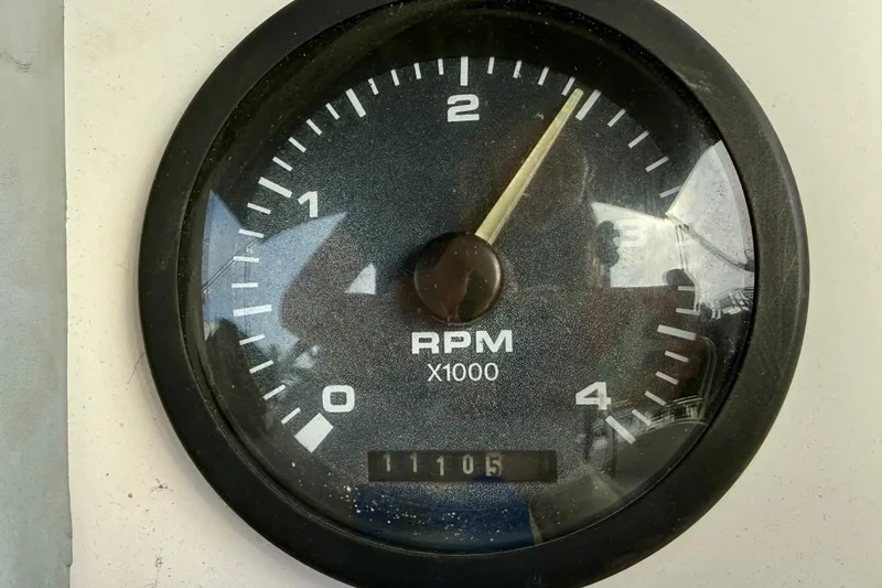 Slide: The Image of Close-up of RPM gauge on 2000 Hunter 290 boat, showing 11105 hours. - 14