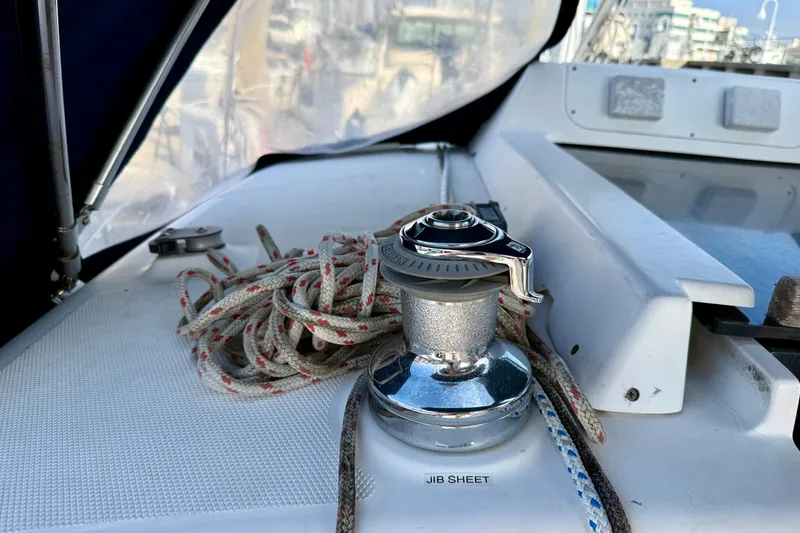 Slide: The Image of Winch and ropes on a 2000 Hunter 290 sailboat deck, labeled "Jib Sheet." - 15