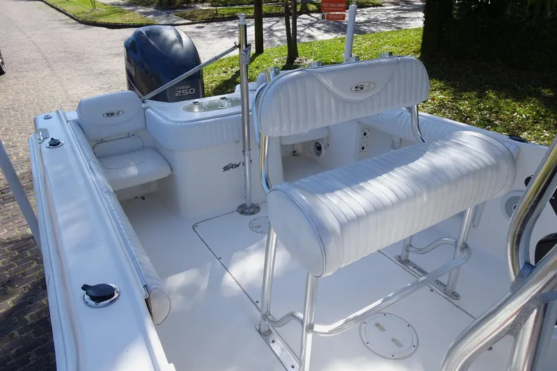 Slide: The Image of 2007 Sea Hunt Triton 232 boat interior with Yamaha 250 engine, white seating, and clean deck. - 11