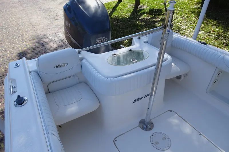 Slide: The Image of 2007 Sea Hunt Triton 232 boat interior with Yamaha 250 engine, featuring white seating and livewell. - 12
