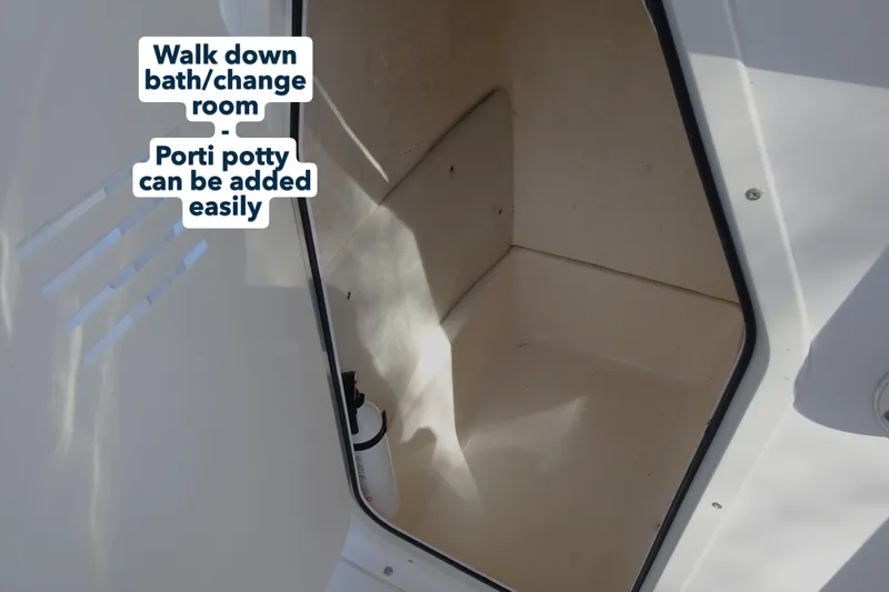 Slide: The Image of 2007 Sea Hunt Triton 232 walk-in bath/change room with porti potty option. - 16