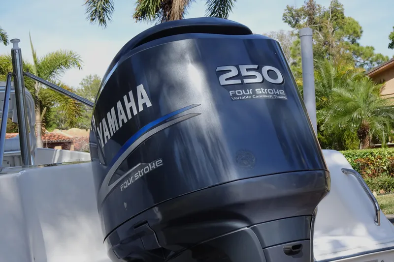Slide: The Image of Yamaha 250 Four Stroke engine on 2007 Sea Hunt Triton 232 boat, surrounded by lush greenery. - 19
