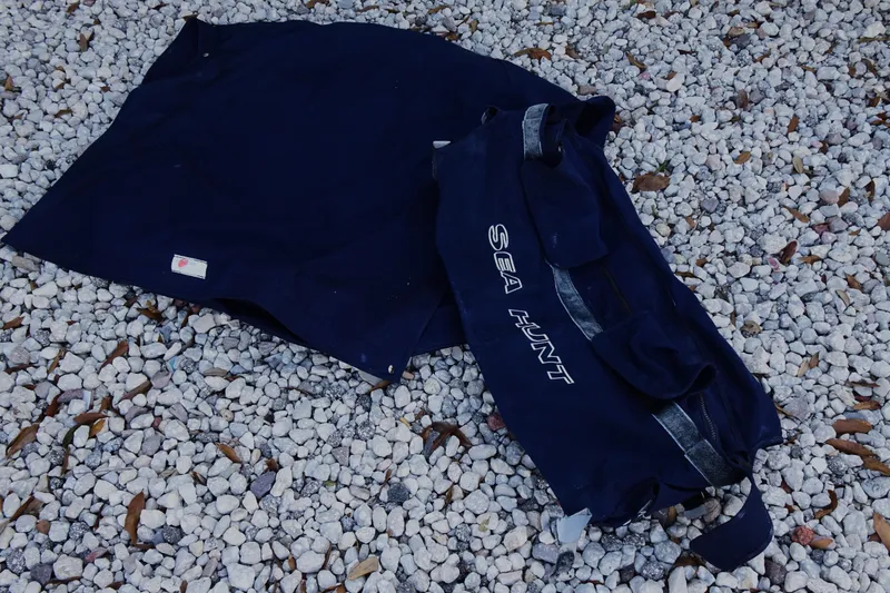 Slide: The Image of Protective cover for 2007 Sea Hunt Triton 232 on gravel surface. - 20